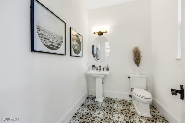 bathroom with tile patterned floors and toilet