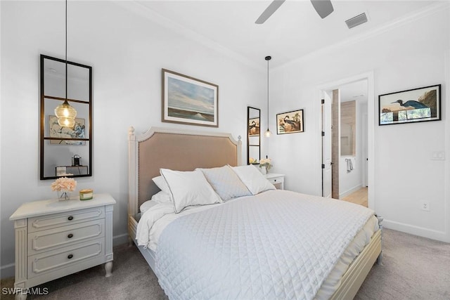 carpeted bedroom featuring ensuite bathroom, ceiling fan, and ornamental molding