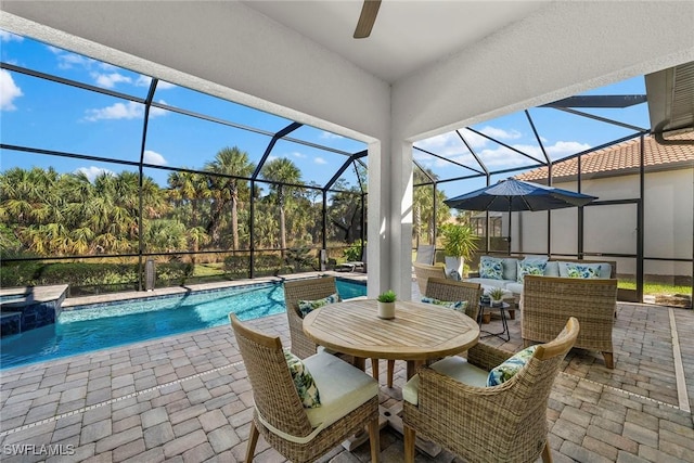 view of swimming pool with outdoor lounge area, glass enclosure, and a patio