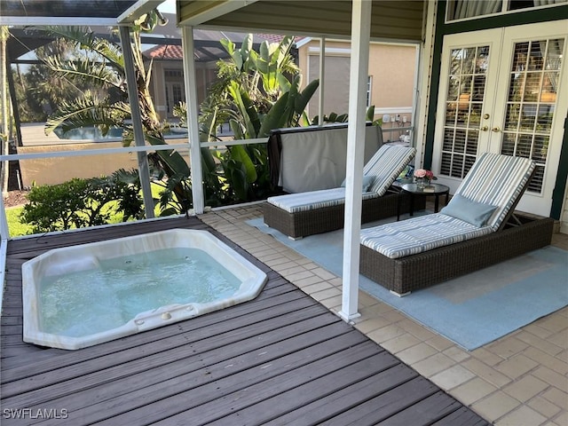 view of pool with french doors