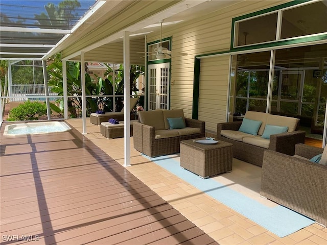 deck with an outdoor living space and a lanai