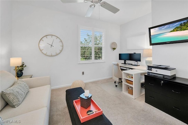 carpeted office space with ceiling fan