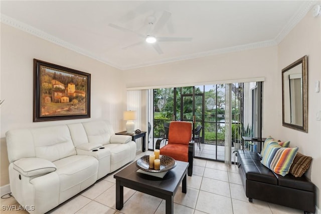 tiled living room with ceiling fan and ornamental molding