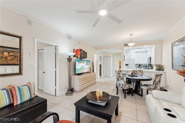 living room with ceiling fan, light tile patterned floors, and ornamental molding