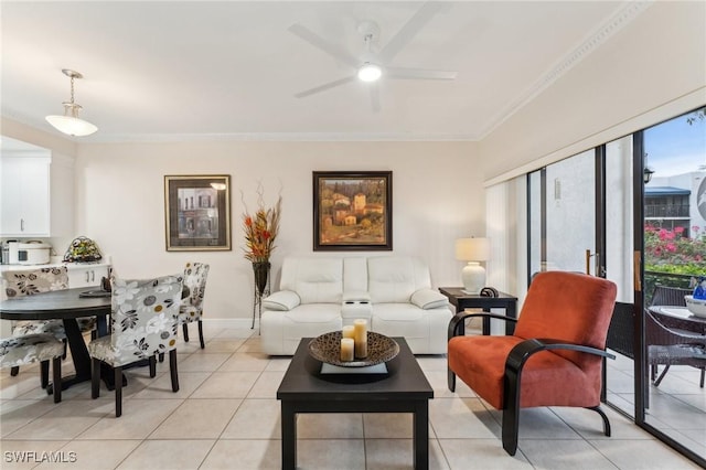 living room with ceiling fan, light tile patterned floors, and crown molding