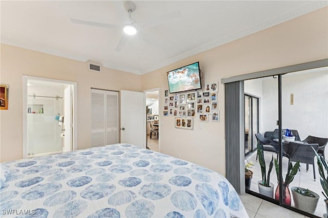 tiled bedroom with ceiling fan, crown molding, and a closet