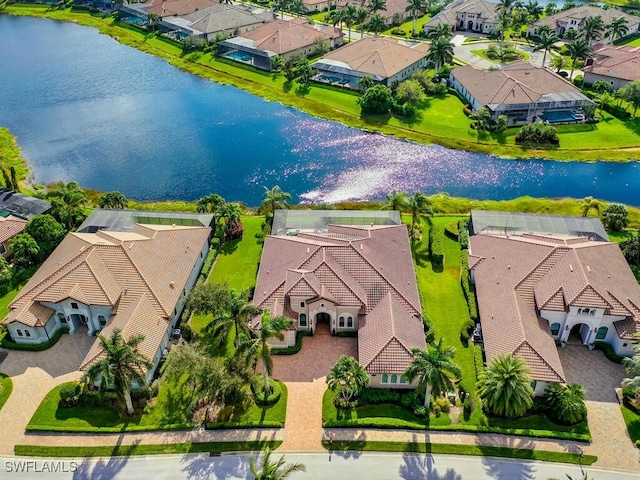 6564 Costa Cir, Naples, FL 34113 - aerial perspective of suburban area featuring a large body of water