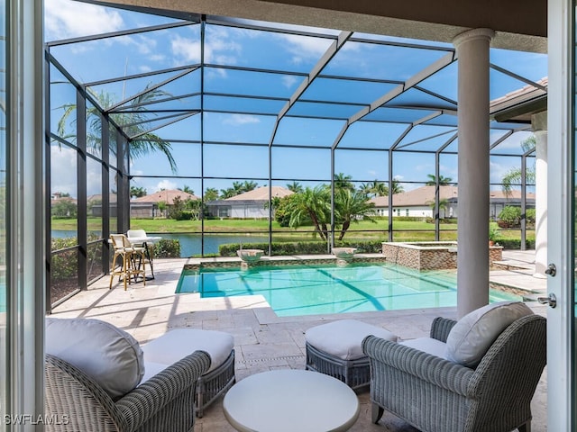 6564 Costa Cir, Naples, FL 34113 - view of swimming pool featuring a patio, glass enclosure, a water view, a pool with connected hot tub, and a residential view