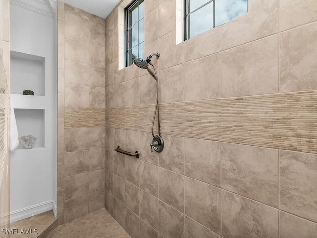 6564 Costa Cir, Naples, FL 34113 - bathroom featuring a tile shower