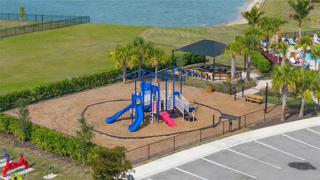 view of jungle gym with a water view