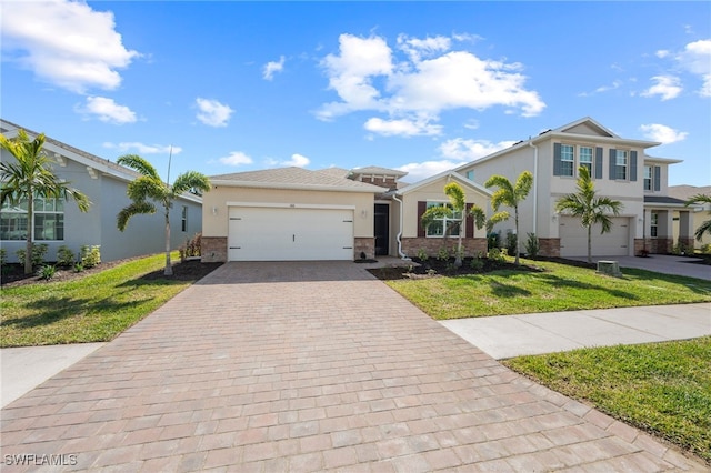 view of front of home featuring a garage and a front yard