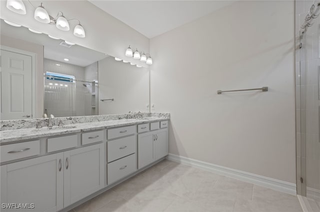 bathroom featuring vanity, tile patterned flooring, and a shower with shower door