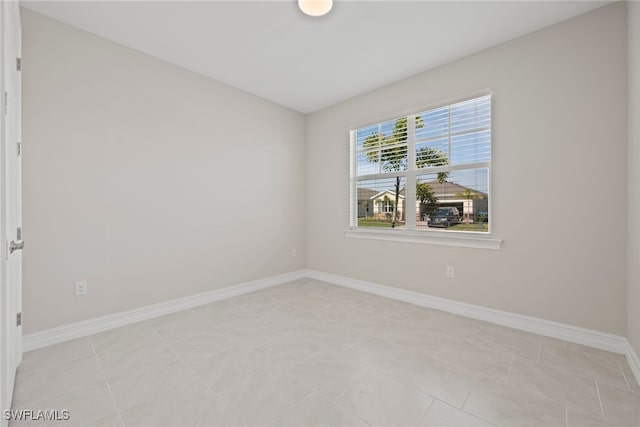 empty room featuring light tile patterned floors