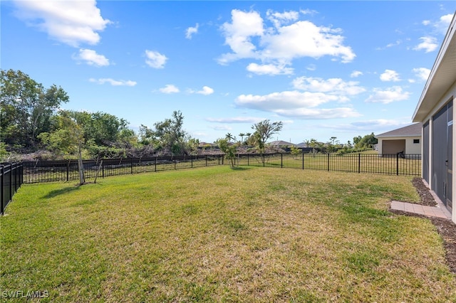 view of yard with a rural view