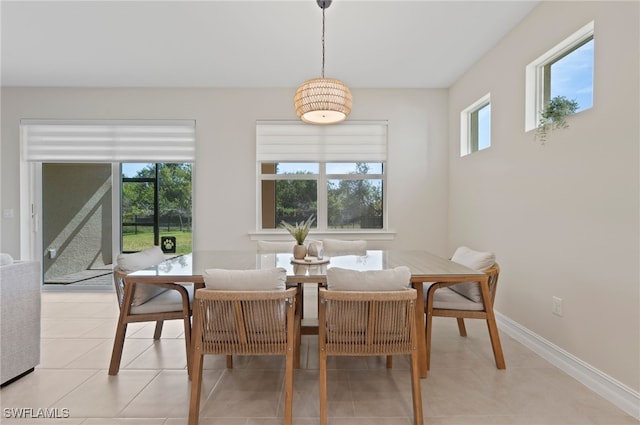 dining area featuring light tile patterned flooring