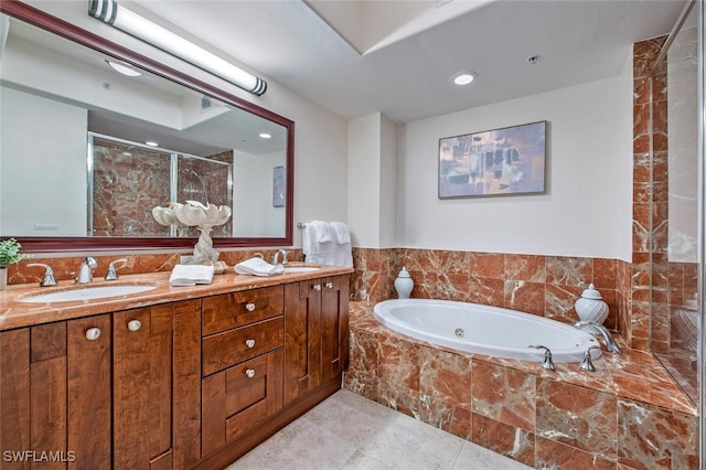 bathroom featuring vanity and separate shower and tub