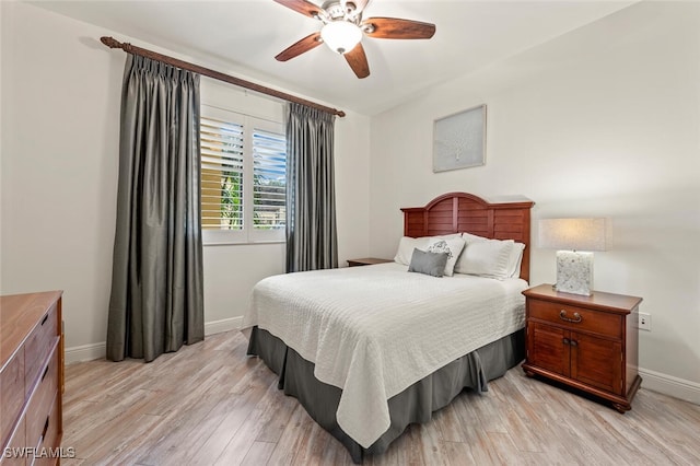 bedroom featuring light hardwood / wood-style floors and ceiling fan