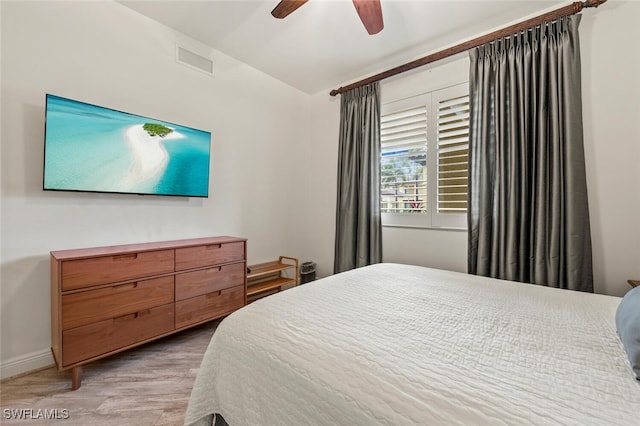 bedroom featuring wood-type flooring and ceiling fan