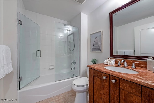 full bathroom with shower / bath combination with glass door, tile patterned floors, toilet, and vanity