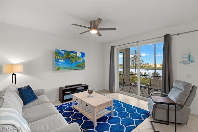 living room featuring ceiling fan and light tile patterned flooring