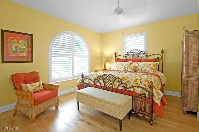 bedroom featuring light wood-type flooring and ceiling fan