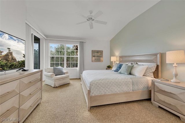 carpeted bedroom featuring lofted ceiling and ceiling fan