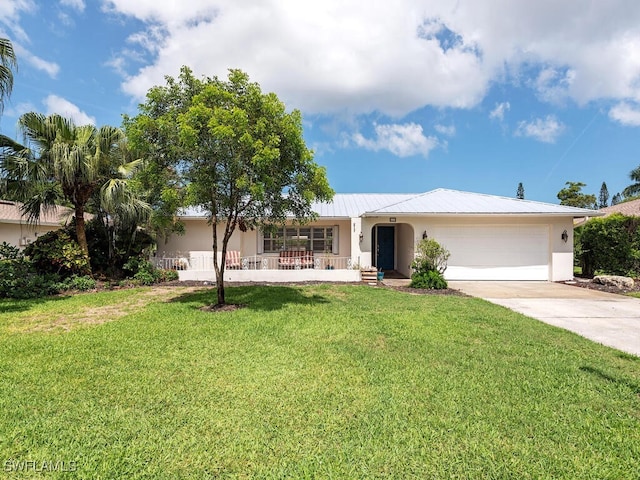 ranch-style home with a garage, a porch, and a front lawn