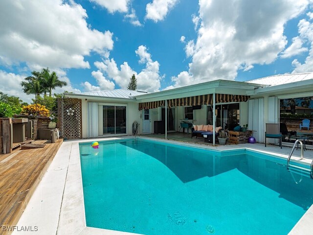 view of pool with an outdoor living space