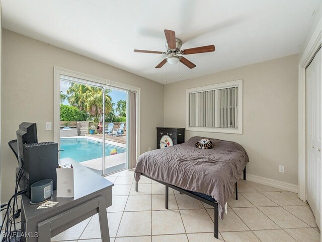 bedroom featuring access to outside, light tile patterned flooring, ceiling fan, and a closet