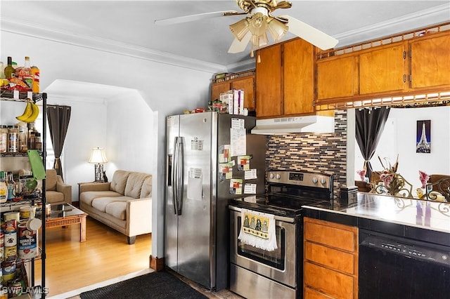 kitchen featuring stainless steel appliances, decorative backsplash, crown molding, ceiling fan, and wood-type flooring