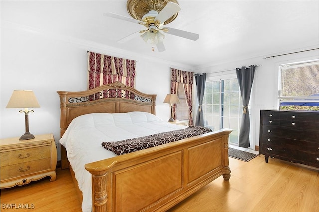 bedroom featuring access to outside, ornamental molding, ceiling fan, and light hardwood / wood-style floors