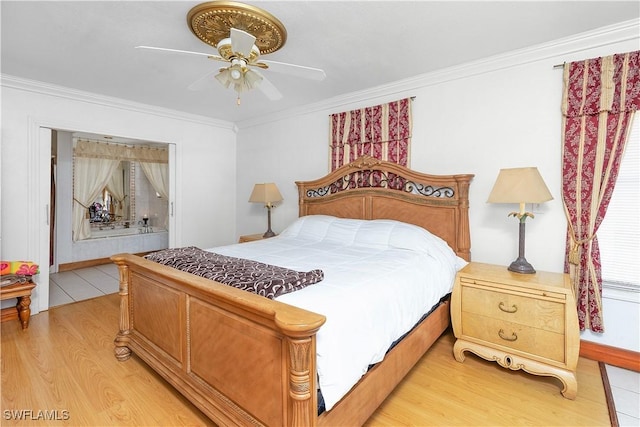 bedroom featuring hardwood / wood-style floors, ceiling fan, and ornamental molding