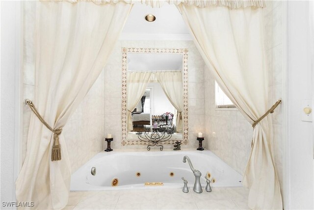 bathroom with tiled tub and crown molding