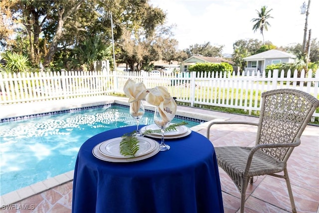 view of swimming pool featuring a patio