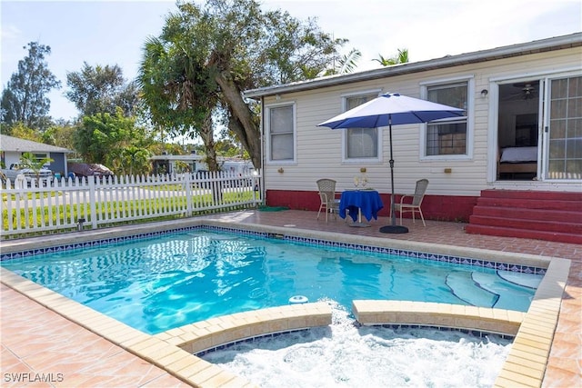 view of swimming pool with a patio area