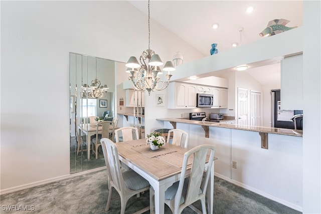 carpeted dining space with a notable chandelier and high vaulted ceiling