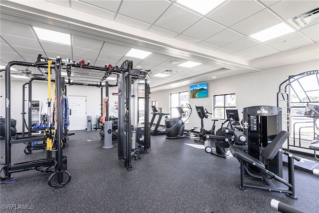 gym featuring a drop ceiling