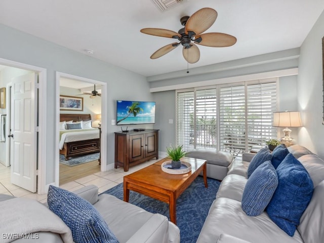 160 Palm St Unit 202, Marco Island, FL 34145 - living room with a ceiling fan and light tile patterned floors