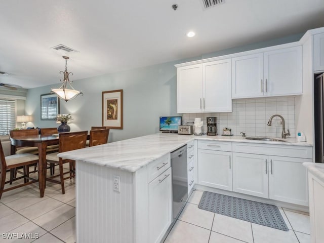 kitchen with hanging light fixtures, white cabinets, kitchen peninsula, and stainless steel appliances