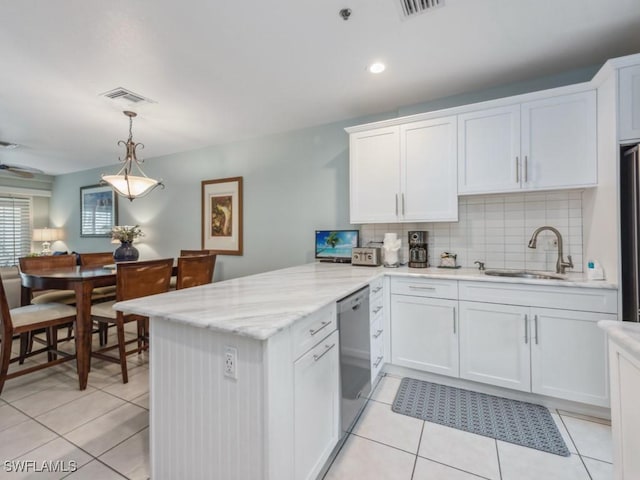 160 Palm St Unit 202, Marco Island, FL 34145 - kitchen featuring stainless steel dishwasher, a peninsula, light tile patterned floors, white cabinetry, and recessed lighting