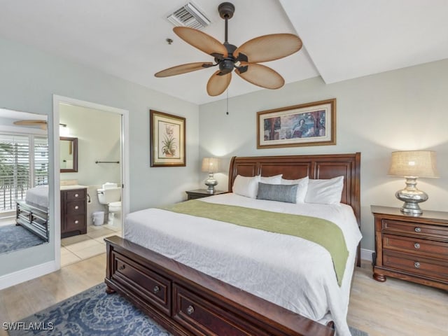 bedroom featuring ceiling fan, connected bathroom, and light hardwood / wood-style flooring