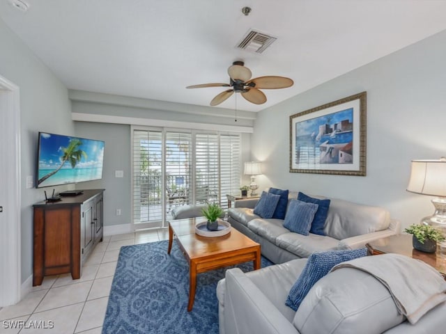 living room featuring ceiling fan and light tile patterned floors