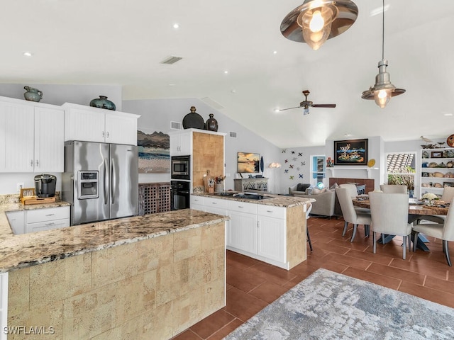 kitchen featuring decorative light fixtures, ceiling fan, black appliances, white cabinetry, and light stone countertops