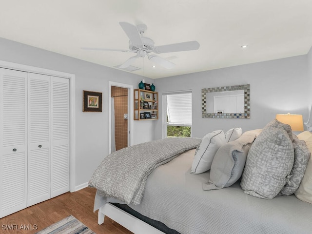 bedroom with ceiling fan, a closet, and wood-type flooring