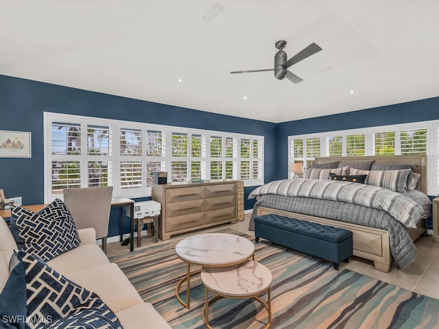 bedroom featuring ceiling fan and multiple windows