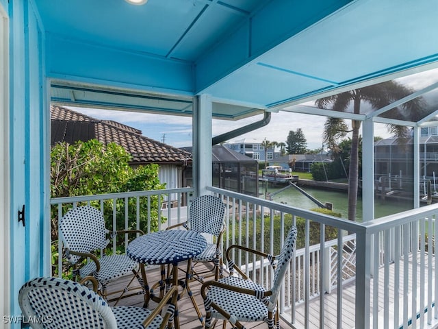 balcony featuring a water view