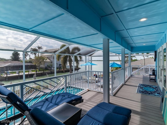 wooden terrace featuring glass enclosure