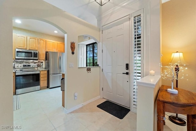 entryway with light tile patterned flooring