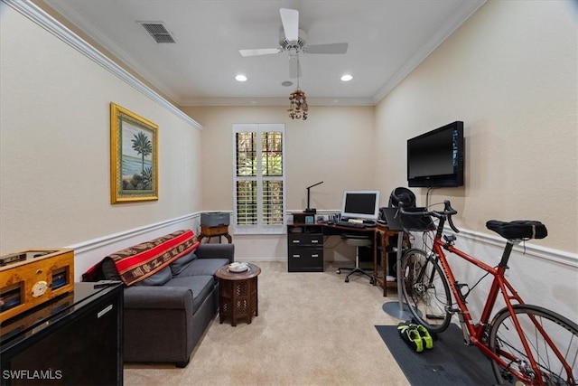 office area with ceiling fan, ornamental molding, and light carpet