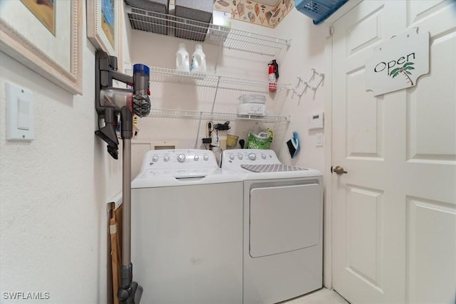 laundry area with washing machine and dryer